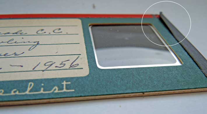 Stereo slide with black tape lifting from the mount; needs tape removed for flat scanning
