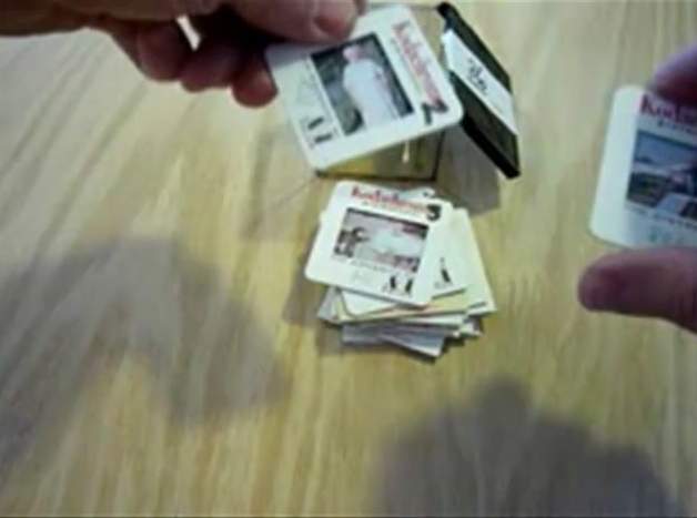 Arranging slides in sequence within the Bell & Howell cube for scanning