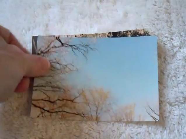 Paper photo prep: cleaning and stacking photos removed from an album