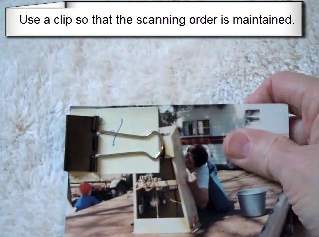 Stacked paper photos aligned in landscape orientation