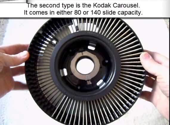 Carefully lifting slides from Kodak carousel to maintain order