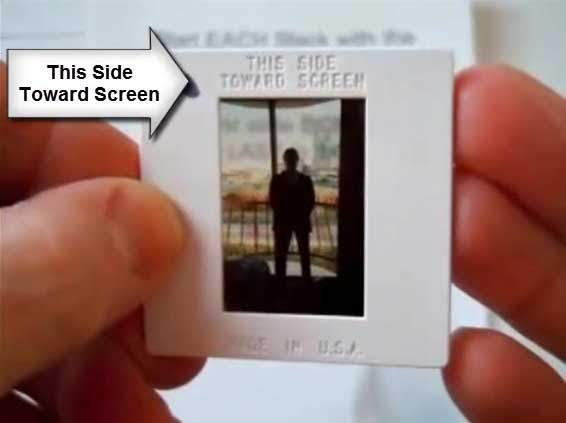 THIS SIDE TOWARDS SCREEN label shown on the front of slide