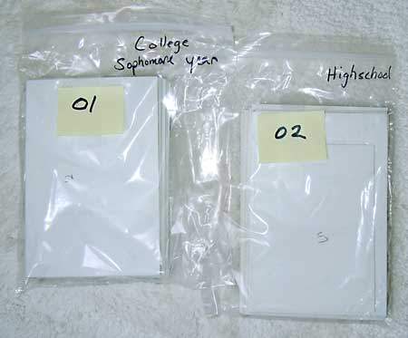 Plastic bags labeled by stack number to organize paper photos before scanning